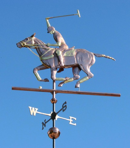 "Polo Horse with Rider Weathervane” One of our most popular horse weathervane designs, this Polo Player weather vane design can be found as far away as Perth, Australia and Bogota, Colombia, as well as in many locations across the United States. Optional gold leaf works very well with this weathervane, helping to set off many of the intricate details such as the tail wrappings, saddle blanket, leg wraps, and reins. One customer who is himself a polo player, also ordered one of our jumping horse weathervanes with a female rider for his second cupola as his wife is also an accomplished equestrian. That way both their passions are represented on their new barn.