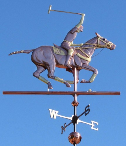 "Polo Horse with Rider Weathervane” One of our most popular horse weathervane designs, this Polo Player weather vane design can be found as far away as Perth, Australia and Bogota, Colombia, as well as in many locations across the United States. Optional gold leaf works very well with this weathervane, helping to set off many of the intricate details such as the tail wrappings, saddle blanket, leg wraps, and reins. One customer who is himself a polo player, also ordered one of our jumping horse weathervanes with a female rider for his second cupola as his wife is also an accomplished equestrian. That way both their passions are represented on their new barn.
