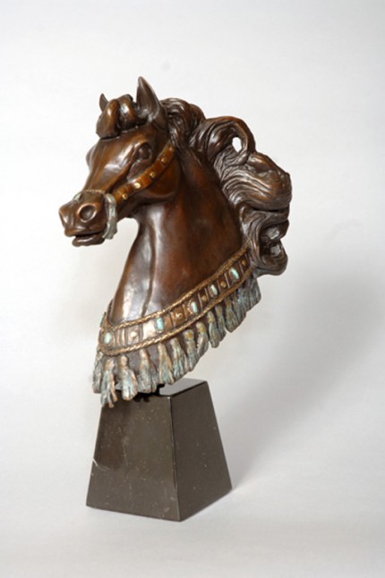 “Arabian Knight” A bust of an Arabian stallion with costuming consisting  of silver and turquoise like tassels is accented by the Black Granite base. (L.E. 50) 6”L x 6”W x 16”H Granite Base