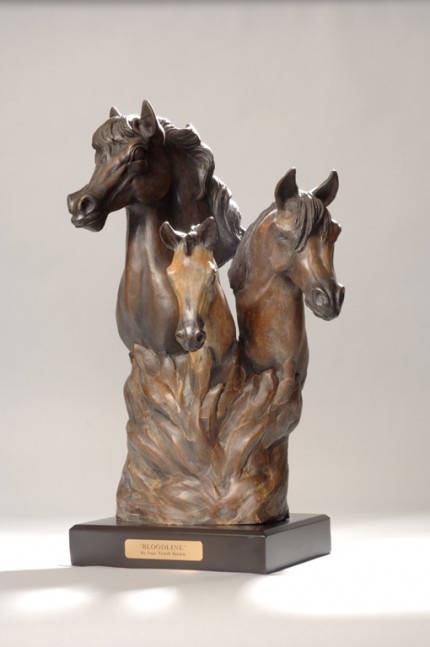 “Bloodline” A bust of 3 Arabians - stallion, mare with foal depicting the circle of life with busts coming from the flames of life. (L.E. 50) 12”L x 12” W x 20”H - Wood Base