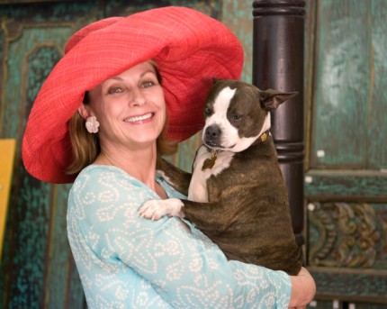 Gallery Owner Jeanne Chisholm, holds Sir Winston (Frederick Churchill) Chisholm, a Palm Beach County rescued dog she describes as ‘ambassador-at-large’ for Chisholm Gallery.