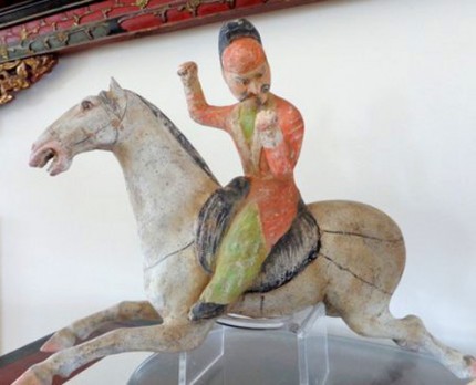This set of two polo players is from the Tang Dynasty, c. 618-907 AD. The players each measure about 8 ½" high, and the horses are about 12" long. There is original polychrome remaining and they are both in excellent condition. They come with Thermoluminescence Reports from Oxford dated in 2002.