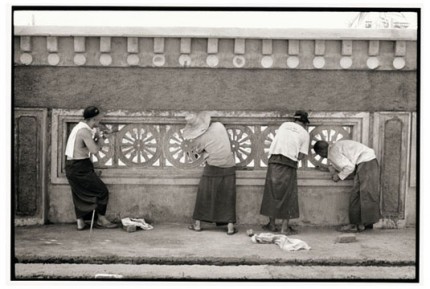 "Cleaning the wheels of Dharma on a fence" Gelatin silver print, Edition of 25, Paper size: 50 x 60 cms, Also available in 40 x 50 cms & 76 x 100 cms