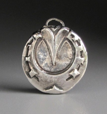 “Farriers’ View Horseshoe” 7/8" Diameter, Price: $189, Chisholm Ref. #: S-FA6 | This particular perspective of a horseshoe is familiar to farriers, and to anyone who has ever cared for a horse. Handcrafted in .960 silver.