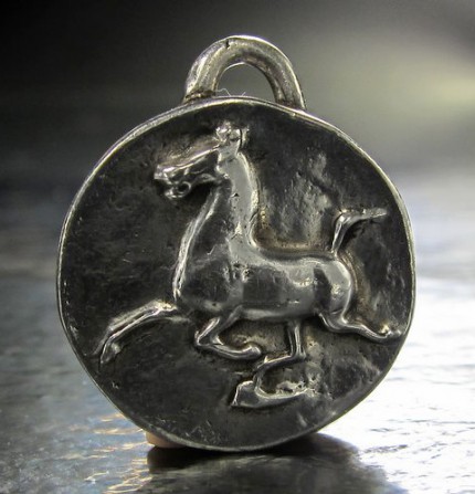 “Han Flying Horse” 1.25" Diameter, Price: $199, Chisholm Ref. #: F-EA5 | Large silver piece featuring the classic image of the Han Dynasty Flying Horse. This makes a dramatic necklace when paired with a rolo chain and worn in front with a toggle clasp.