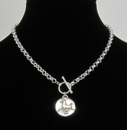 “Han Flying Horse” 1.25" Diameter, Price: $199, Chisholm Ref. #: F-EA5 | Large silver piece featuring the classic image of the Han Dynasty Flying Horse. This makes a dramatic necklace when paired with a rolo chain and worn in front with a toggle clasp.