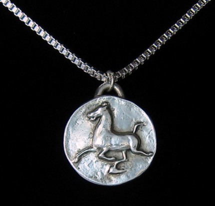“Han Flying Horse” 1.25" Diameter, Price: $199, Chisholm Ref. #: F-EA5 | Large silver piece featuring the classic image of the Han Dynasty Flying Horse. This makes a dramatic necklace when paired with a rolo chain and worn in front with a toggle clasp.