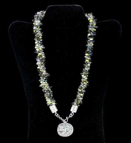 “Jade Chariot Beadwork & Silver Necklace” Pendant: 1.25" x 1.125", Overall length: 22", Price: $650, Chisholm Ref. #: SBW-N5 - This one-of-a-kind silver and beadwork necklace is made of yellow jade, smokey quartz, and Czech fire-polished crystals. The handmade end caps are lightly textured, and the focal pendant is a stunning classical charriot made in .960 silver.