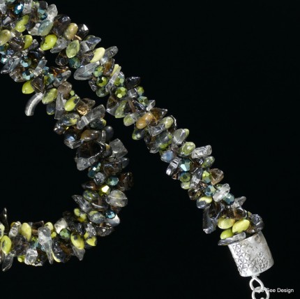 “Jade Chariot Beadwork & Silver Necklace” Pendant: 1.25" x 1.125", Overall length: 22", Price: $650, Chisholm Ref. #: SBW-N5 - This one-of-a-kind silver and beadwork necklace is made of yellow jade, smokey quartz, and Czech fire-polished crystals. The handmade end caps are lightly textured, and the focal pendant is a stunning classical charriot made in .960 silver.