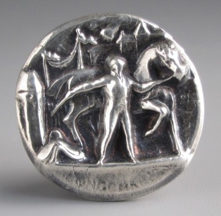 “Longchamps” 1.125" diameter, Price: $199, Chisholm Ref. #: S-SH3 - Racing afficianados will recognize this pendant as a tribute to Longchamp Racecourse, located on the banks of the Seine River in Paris. The high relief iinvites you to step into the scene, with the grandstands in the background and the horse and his groom in the foreground. The word "Longchamps" is visible on the lower part of the pendant, although it is hard to capture in photographs. Hand crafted in .960 silver.