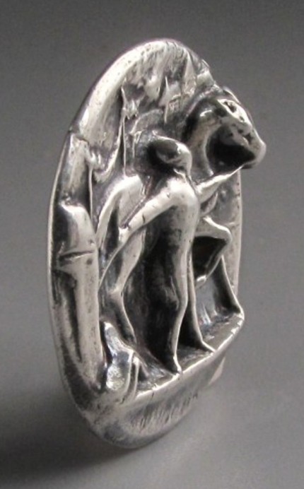 “Longchamps” 1.125" diameter, Price: $199, Chisholm Ref. #: S-SH3 - Racing afficianados will recognize this pendant as a tribute to Longchamp Racecourse, located on the banks of the Seine River in Paris. The high relief iinvites you to step into the scene, with the grandstands in the background and the horse and his groom in the foreground. The word "Longchamps" is visible on the lower part of the pendant, although it is hard to capture in photographs. Hand crafted in .960 silver.
