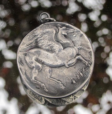 “Pegasus (large)” Diameter: 1.25", Price: $299, Chisholm Ref. #: S-EA2 | This wonderful, large piece shows Pegasus with his wings spread, as seen on an ancient Greek coin. The reverse side typically features a feather texture.