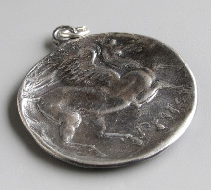 “Pegasus (large)” Diameter: 1.25", Price: $299, Chisholm Ref. #: S-EA2 | This wonderful, large piece shows Pegasus with his wings spread, as seen on an ancient Greek coin. The reverse side typically features a feather texture.