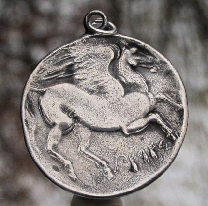 “Pegasus (large)” Diameter: 1.25", Price: $299, Chisholm Ref. #: S-EA2 | This wonderful, large piece shows Pegasus with his wings spread, as seen on an ancient Greek coin. The reverse side typically features a feather texture.