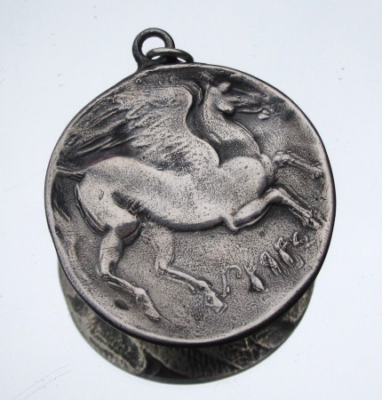 “Pegasus (large)” Diameter: 1.25", Price: $299, Chisholm Ref. #: S-EA2 | This wonderful, large piece shows Pegasus with his wings spread, as seen on an ancient Greek coin. The reverse side typically features a feather texture.