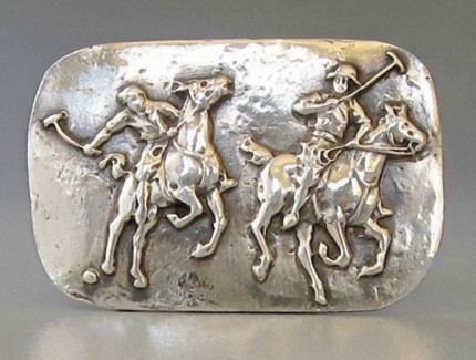 “Polo Action” Price: $289, Chisholm Ref #: S-SH1 - Two polo player jostle for position as one prepares to strike the ball. Handcrafted in .960 silver. Strong on black leather cord with sterling clasp.