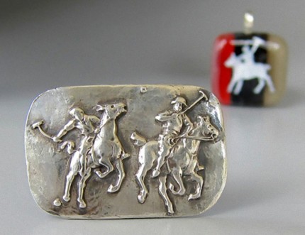 “Polo Action” Price: $289, Chisholm Ref #: S-SH1 - Two polo player jostle for position as one prepares to strike the ball. Handcrafted in .960 silver. Strong on black leather cord with sterling clasp.