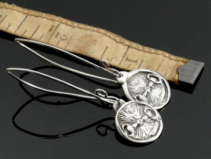 “Snaffle Bit Earrings” Overall length: 2", Price: $149, Chisholm Ref. #: SE6 - Snaffle bits are the motif in these round earring on long ear wires. Earrings are hand crafted in .960 silver. Ear wires are sterling silver (.925).